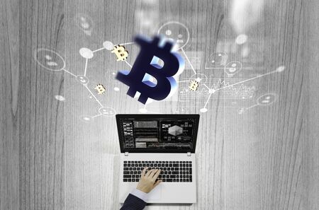 Top view of businesswoman working on laptop and crypto symbols. 3d renderingの写真素材