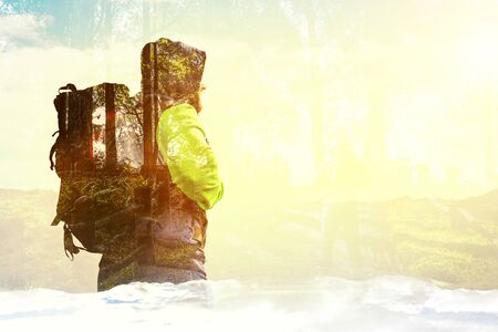 Back view of tourist with backpackの写真素材