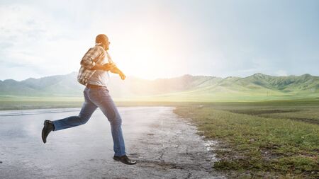 Black man in casual clothes in motion