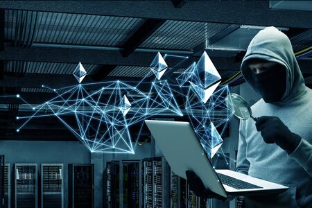 Hacker hunting for crypto currencyの写真素材
