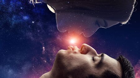 Couple of lovers kissing under the milky way