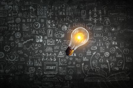 Business success ideas sketched on dark wallの写真素材