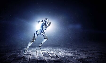 Woman cyborg running on dark background. Mixed mediaの写真素材