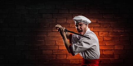 He is crazy about cooking. Mixed mediaの写真素材