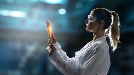 Attractive woman scientist and media interface panel. 3d renderingの写真素材