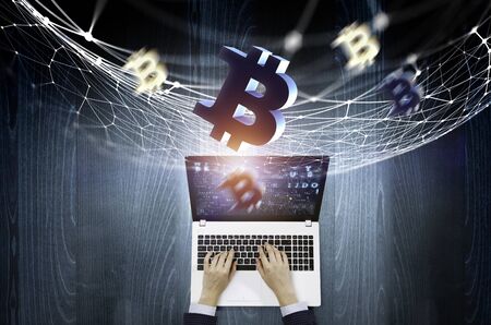 Top view of businesswoman working on laptop and crypto symbols. 3d renderingの写真素材