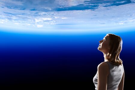Girl looking at Earth planet