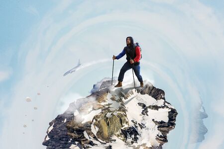 Male tourist with backpack walking on big stone. Mixed media