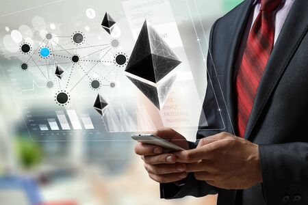 Close of businessman holding mobile phone and bitcoin concept. 3d renderingの写真素材