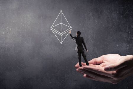 Elegant businessman with back drawing crypto currency concept. 3d renderingの写真素材