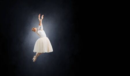 Young ballerina dancer in tutu performing on pointes. 3d renderingの写真素材