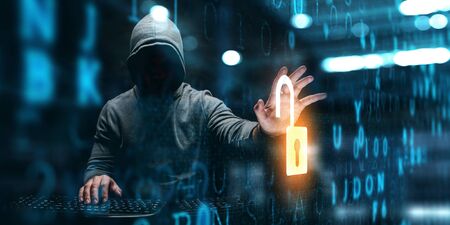 Silhouette of haker in hoodie against dark technology background