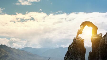 Extreme yoga practice. Mixed mediaの写真素材