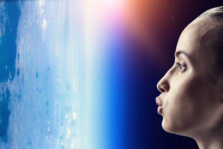 Girl kissing Earth planet . Mixed media