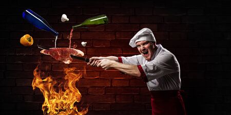 He is crazy about cooking. Mixed mediaの写真素材