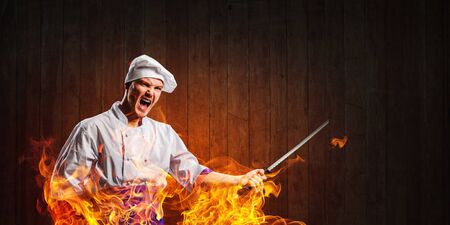 He is crazy about cooking. Mixed mediaの写真素材