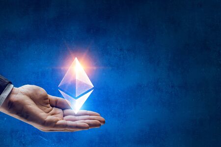 Close of businessman holding in palm ethereum sign. 3d rendering