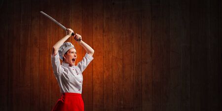 She is crazy about cooking. Mixed mediaの写真素材