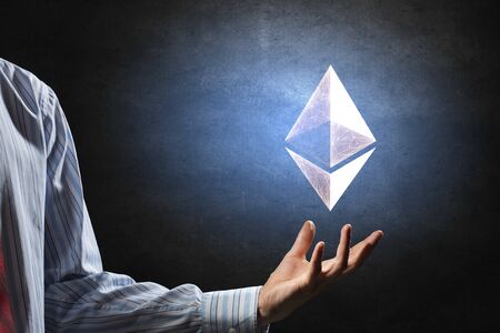 Close of businessman holding in palm ethereum sign. 3d rendering