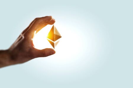 Close of businessman holding in palm ethereum sign. 3d renderingの写真素材