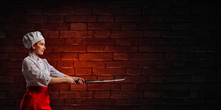 He is crazy about cooking. Mixed mediaの写真素材