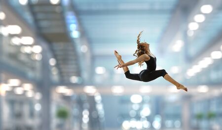 Gymnast girl in jump Mixed mediaの写真素材