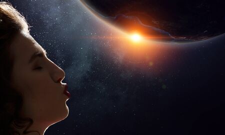 Woman kiss globe . Mixed mediaの写真素材