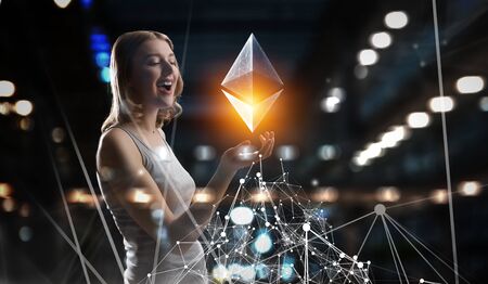 Young attractive woman and ethereum symbol on technology background. 3d renderingの写真素材