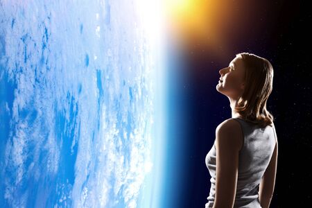Girl looking at Earth planet