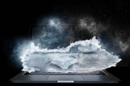 Laptop on dark background and waves out of screen. Mixed mediaの写真素材