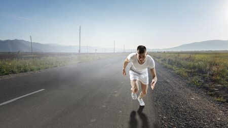 Athlete man running race. Mixed mediaの写真素材