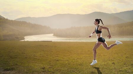 Beautiful woman running cross country. Mixed media
