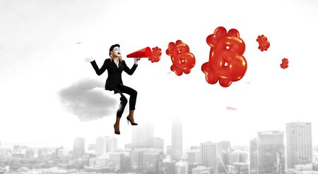 Woman in black suit and mime painted face presenting bitcoin concept. Mixed mediaの写真素材