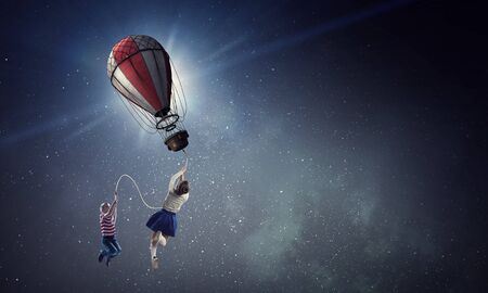 Girl fly in sky. Mixed mediaの写真素材