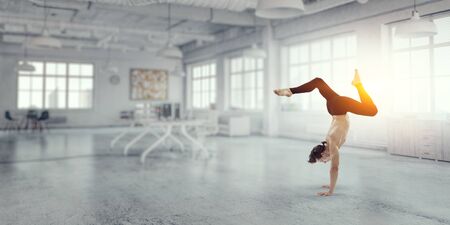 Dancer guy doing onehand stand. Mixed mediaの写真素材