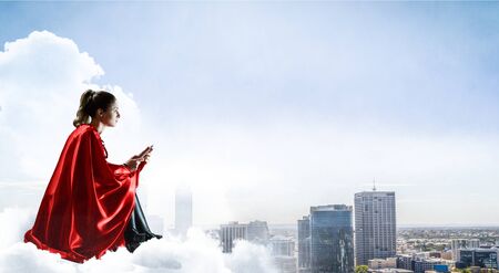 Super hero on roof. Mixed mediaの写真素材