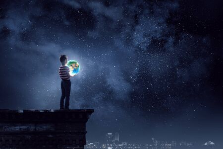 Whole world in hands . Mixed mediaの写真素材