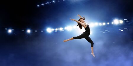 Gymnast girl in jump Mixed mediaの写真素材