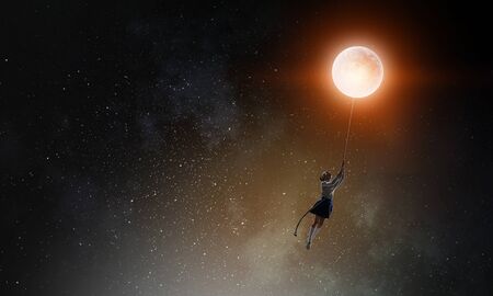 Girl holds the moon . Mixed mediaの写真素材