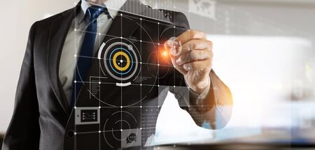 Close of businessman drawing abstract business chart holograms on screen. Mixed mediaの写真素材