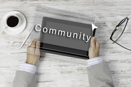 Top view of tablet at table and businessman sittingの写真素材