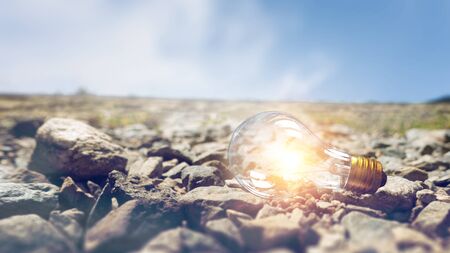 Glass glowing bulb outdoor lying on groundの写真素材