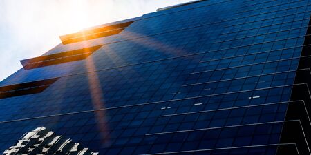 Bottom angle view of glass blue buildingの写真素材