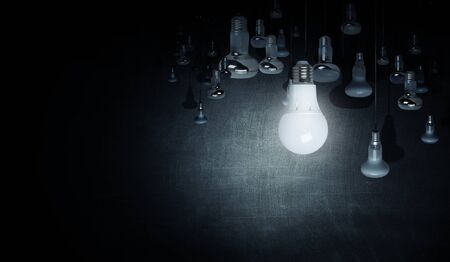 Many glass light bulbs hanging from aboveの写真素材