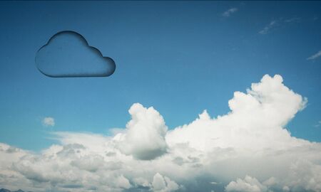 Cloud silhouette or icon in blue skyの写真素材