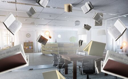 Business or education stuff and items flying in air . Mixed media