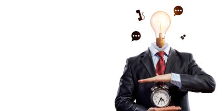 Businessman with light bulb instead of head and clock in hands. Mixed media