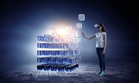 Woman wearing virtual reality goggles. Mixed media