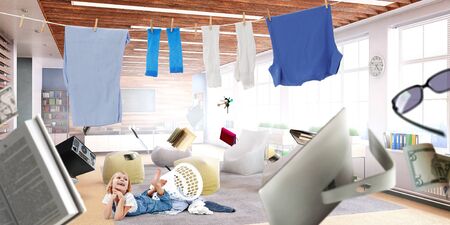 Happy little girl with washed clothesの写真素材