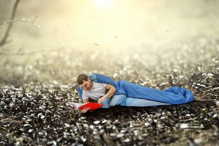 Young traveler in sleeping bagの写真素材